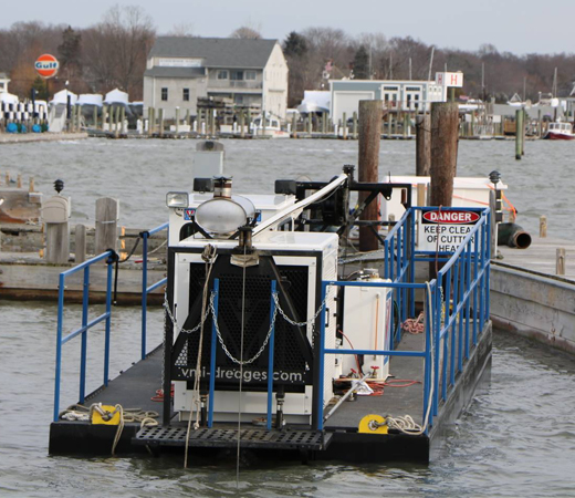 A VMI horizontal dredger working on location at a marina